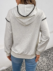 Women's light grey contrast trim hooded sweatshirt with black decorative stitching