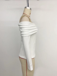 Detail shot of the white ribbed texture and off-shoulder neckline on the knitted top