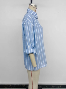 Detail of blue striped cotton shirt featuring button cuffs and classic lapel collar