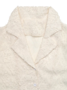 Detail shot of ivory long sleeve shirt featuring premium 3D fringe textured fabric