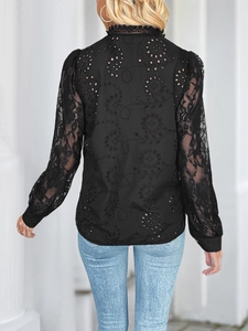 Back view of black long-sleeved lace shirt featuring elegant hollow embroidery details