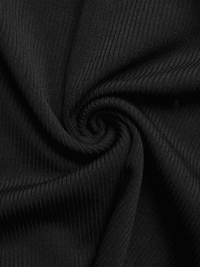 Close-up of black ribbed knit fabric showing detailed texture and elastic material