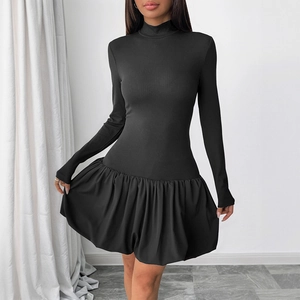Long sleeve black knit dress featuring a high neck design and voluminous bubble skirt