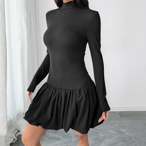 Long sleeve mock neck dress featuring a ribbed knit top and pleated black bubble skirt