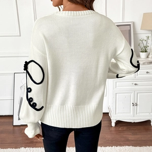 Pull en maille crème pour femme avec détails jacquard noirs aux manches, coupe large