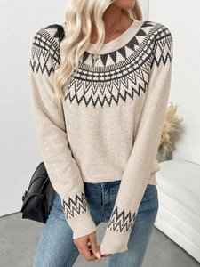 Close-up of Fair Isle geometric jacquard pattern on a cream-colored knit sweater