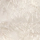 Close-up of premium cream faux fur fabric texture showing soft long plush fibers