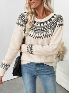 Close-up of Fair Isle geometric knit pattern on a cream vintage crewneck sweater