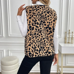Women's leopard print faux shearling vest shown from the back in a modern interior