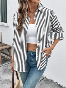 Classic black and white vertical striped long sleeve shirt with a lapel collar and buttons