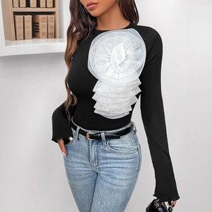 Long sleeve bodysuit with a 3D white mesh flower accent on a ribbed black top for women