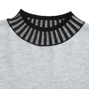Detailed macro view of the striped ribbed neckline on a grey knit sweater dress