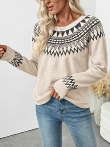 Detailed close-up of Fair Isle geometric patterns on a beige crewneck knitted sweater
