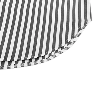 Macro shot of curved hem on striped shirt showing clean stitching and high-quality fabric