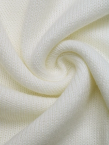 Detailed macro view of ivory white knit fabric texture with soft wool-like finish