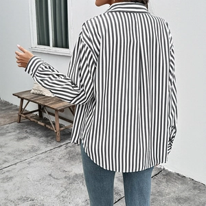 Back view of women's casual striped long-sleeved shirt with lapel collar and curved hem