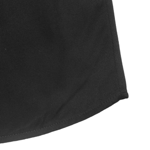 Close-up of the elegant black lace dress featuring twill texture and curved hem stitching