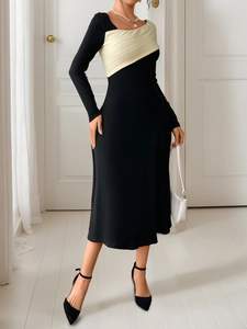 Detailed close-up of the elegant patchwork design with cream knit and black midi dress