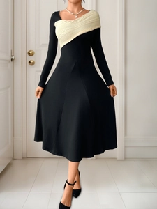Detail view of the asymmetric color-block knit patchwork on this elegant long dress