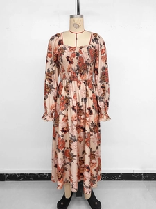 Detailed macro view of vintage floral print dress with square neck and ruched chest design