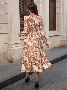 Detailed back view of a French style long sleeve printed dress with tiered ruffle hem
