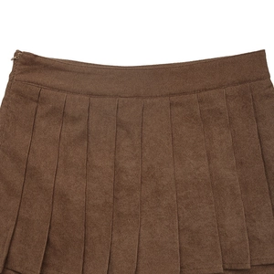 Detailed view of brown corduroy pleated shorts with high waist and side zipper