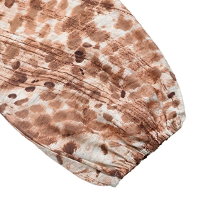 Detailed view of elasticated leopard print cuffs on a French style long sleeve dress