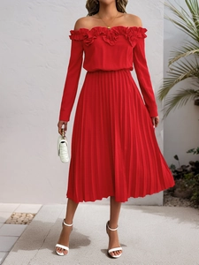 Detailed close-up of French lace neckline and pleated sleeves on a red off-shoulder dress