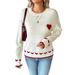 Women's cream knit sweater with large red heart and jacquard patterns on sleeves