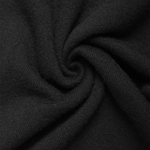 Detailed close-up of premium black knit fabric texture showing fine weave and soft drape