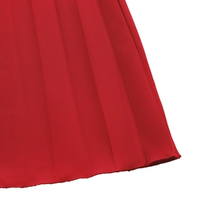 Detail of red pleated skirt showing the fine synthetic fabric texture and hem finish