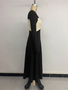 Detail of elegant black long sleeve dress with cream textured knit bodice insert