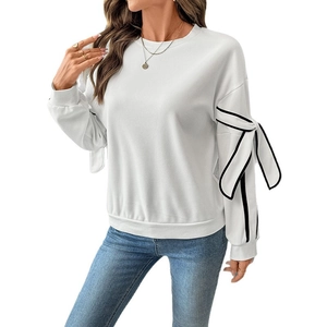 White crewneck sweatshirt for women featuring black contrast bow ties on sleeves