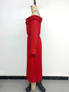 Detailed close-up of the ruffled off-shoulder neckline on this red pleated maxi dress