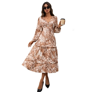 French style V-neck long sleeve printed dress with ruffled hem and abstract pattern