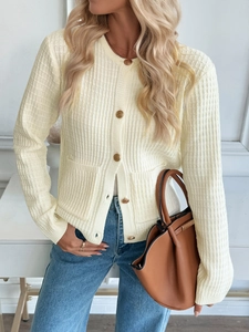 Detailed view of cream knit cardigan featuring elegant gold buttons and ribbed texture