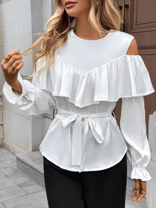 Detailed view of white off-shoulder blouse with ruffled V-neckline and waist tie design