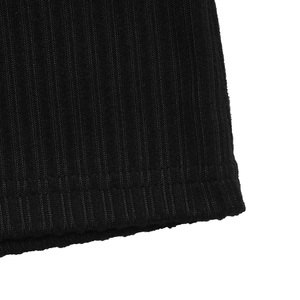 Detailed macro view showing the ribbed knit texture and double-needle stitching on black fabric