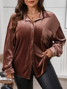 Detail of elegant velvet long sleeve shirt showing collar and front chest pocket texture