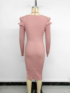 Rear view of pink ribbed knit midi dress featuring elegant back slit and mutton sleeves