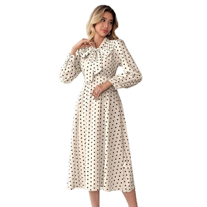 Robe midi rétro à pois avec manches longues, col noué et taille cintrée élégante