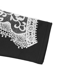 Close-up of black sweatshirt fabric with white lace trim and intricate embroidery