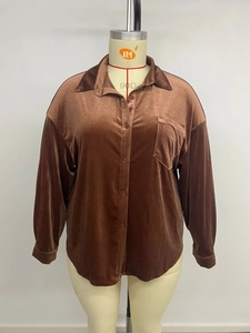 Detailed front view of brown velvet shirt featuring a lapel collar and chest pocket