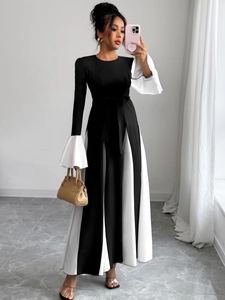 Detail of contrasting flare sleeves and striped skirt on A-line midi dress