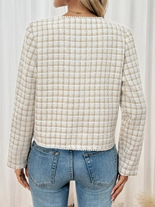 Rear view of elegant tweed jacket showing white pearl trim on collar and sleeves