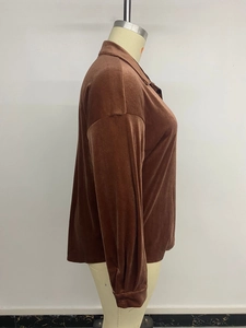 Side view detail of loose velvet brown long sleeve shirt showing the soft texture and collar