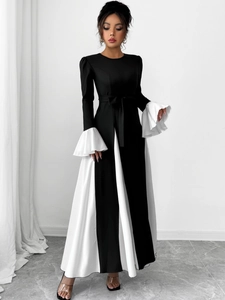 Detail of A-line dress with contrasting black and white panels and flared ruffle sleeves