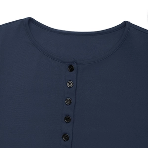 Detail of dark blue ribbed Henley neckline with five black buttons and fine stitching
