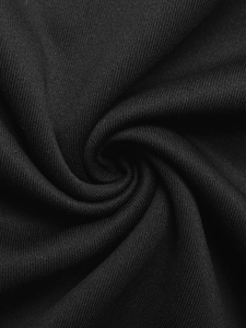 Macro detail of soft black knitted fabric with a fine texture and smooth drape