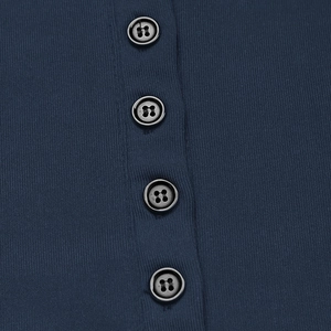 Close-up of navy blue ribbed knit fabric and four black round buttons on a slim top